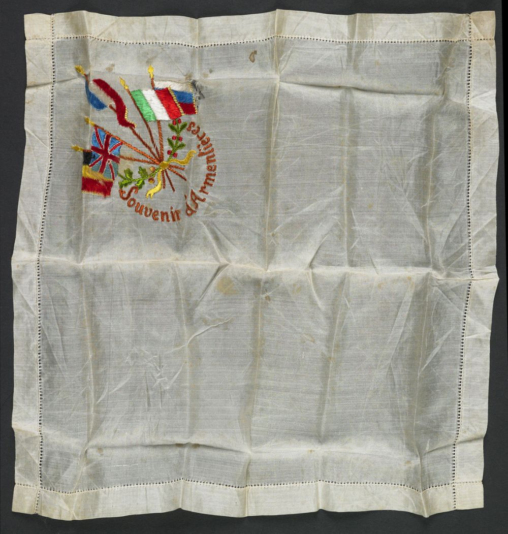 A souvenir handkerchief from Armentières, embroidered with flags.